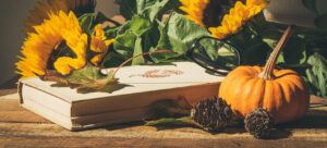 Autumn book and sunflowers