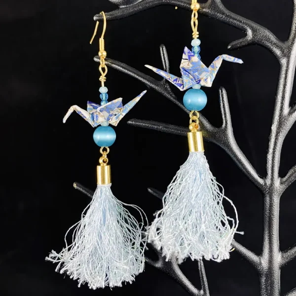 Blue and gold origami crane earrings.